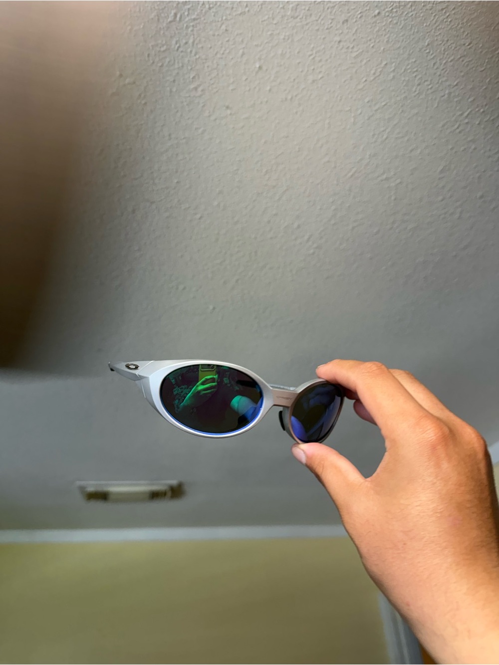Silver Frame Sunglasses with Mirrored Blue-Green Lenses Oakley